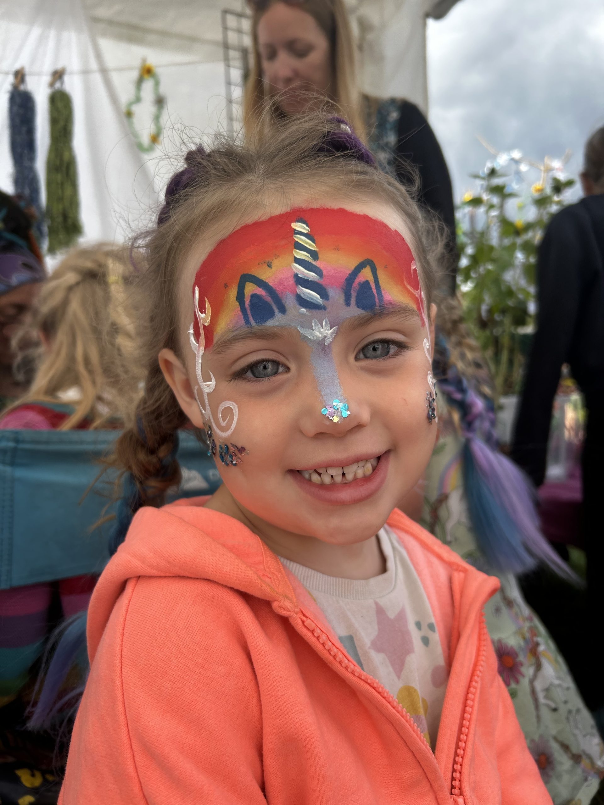 A girl with unicorn face pain